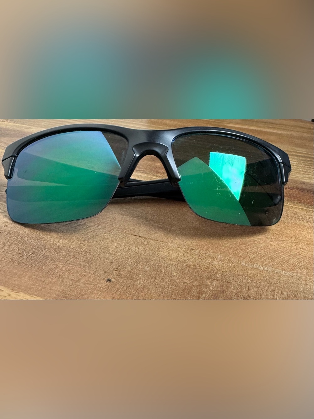 Oakley Men's Black Frame Sunglasses with Green Mirrored Lenses